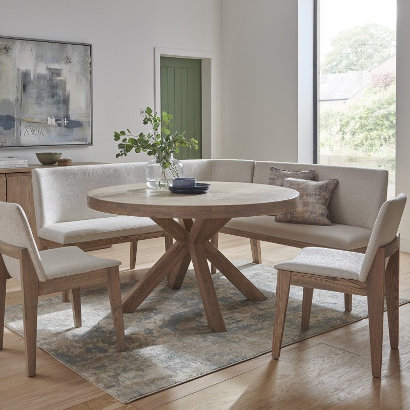 Falun Round Table With Long Corner Bench And 2 Dining Chairs lifestyle image of the dining set