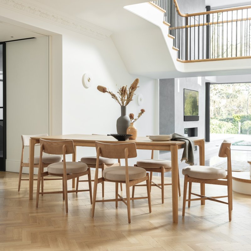 G Plan Winchester Rectangular Extending Dining Table And 6 Grey Flora Chairs lifestyle image of the dining set