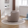Alma Almond Swivel Chair side on lifestyle image of the chair