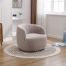 Alma Almond Swivel Chair angled lifestyle image of the chair