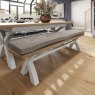 Blickling 2m Crossed Legged Dining Bench lifestyle image of the bench with cushion