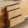 Herringbone 2 Door 3 Drawer Sideboard close up lifestyle image of the sideboard with open drawers