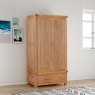 Gloucester Oak Double Door Wardrobe With 2 Drawers lifestyle image of the wardrobe