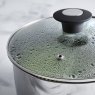 Simply Home 18 CM Stainless Steel Draining Lid Saucepan in use